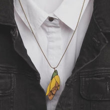 Load image into Gallery viewer, Kowhai flower rimu necklace on model
