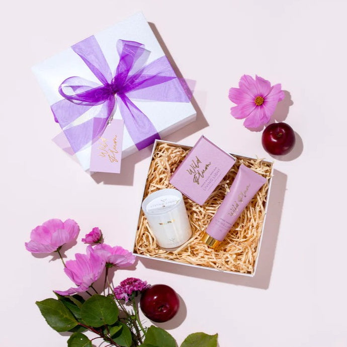 Wild plum gift set has a candle beauty bar and hand cream